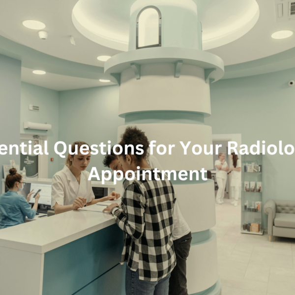 Healthcare providers interacting with a patient in a radiology department setting.