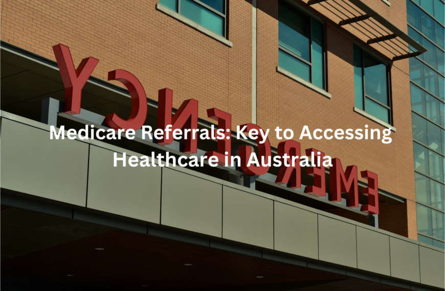 The image shows a large sign on the facade of a building that says "Medicare Referrals: Key to Accessing Healthcare in Australia". The sign has large red lettering against a brick wall background.
