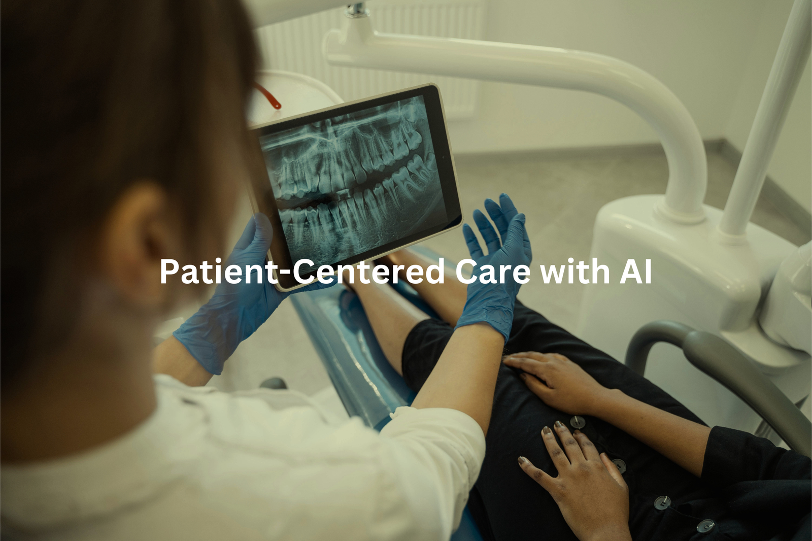 A close-up view of a dentists hands holding a tablet device displaying dental x-ray imagery while examining a patient