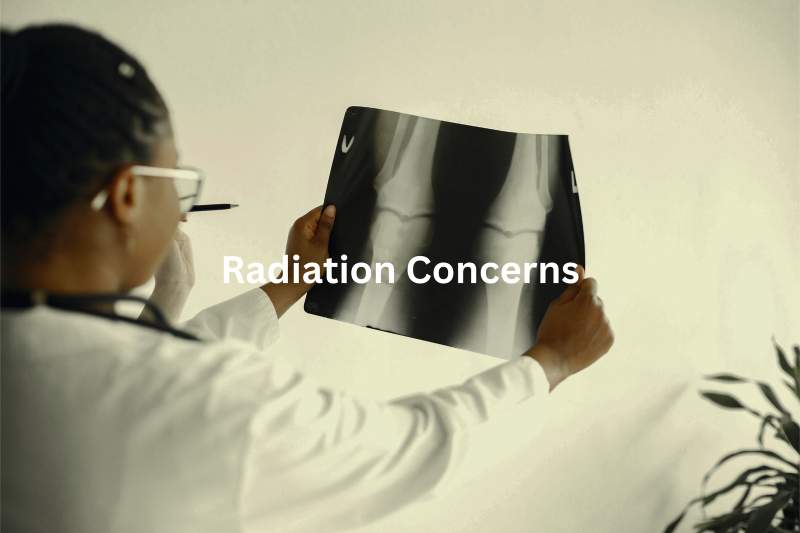 A person in a medical coat holding up an x-ray film with the text Radiation Concerns overlaid