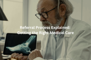 Close-up of an experienced medical professional studying a digital radiographic image, alongside the heading describing the referral system for obtaining necessary care.