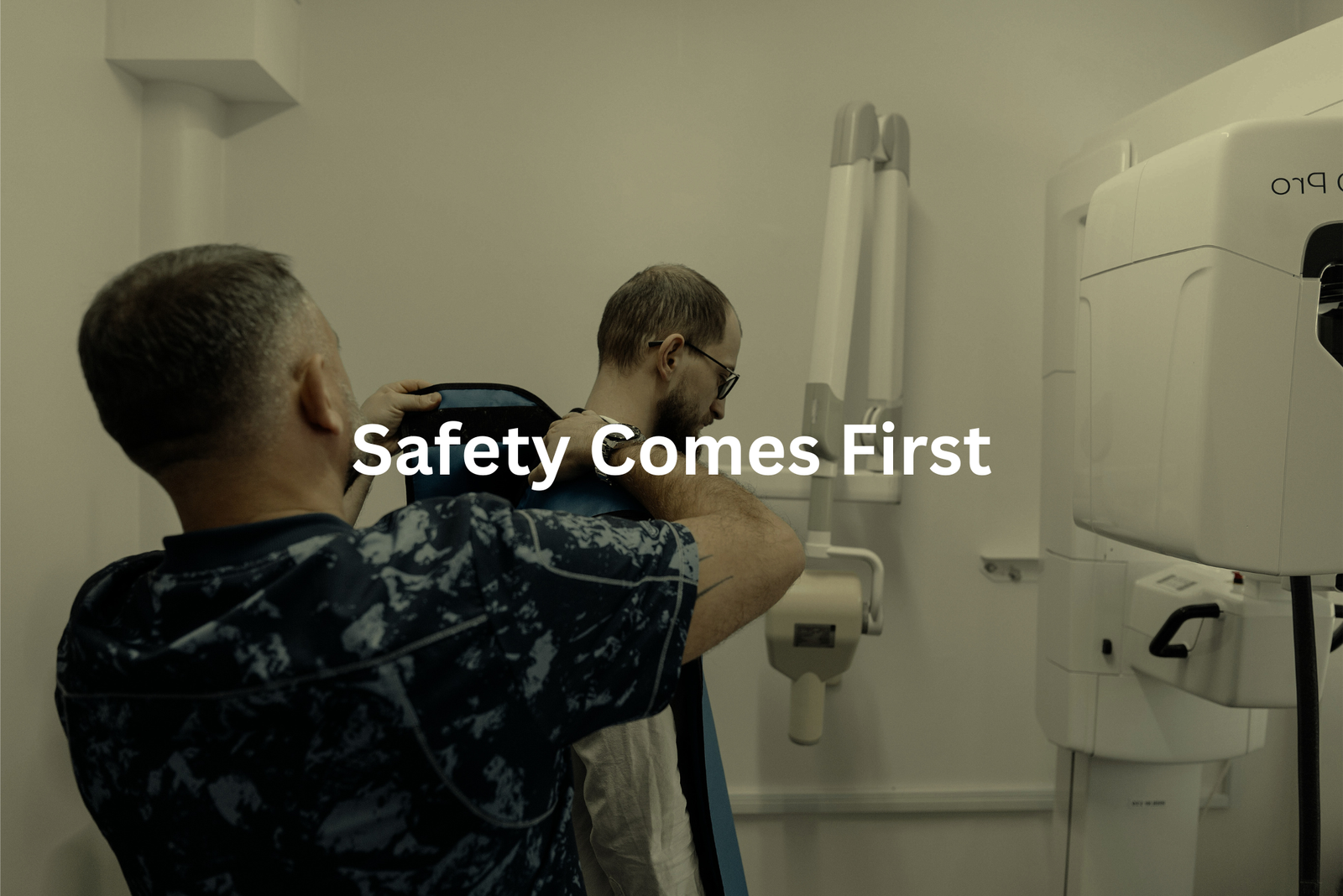 Prioritizing Safety Two individuals in a medical setting with the text Safety Comes First overlaying the image