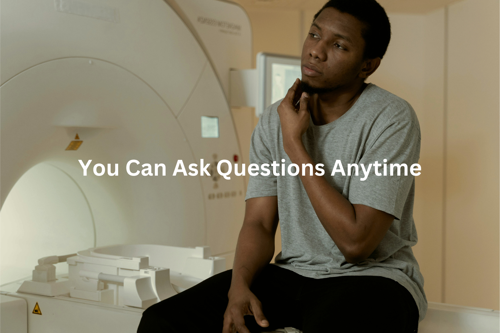 An individual is pictured in a medical environment with a message encouraging patients to ask questions at any time