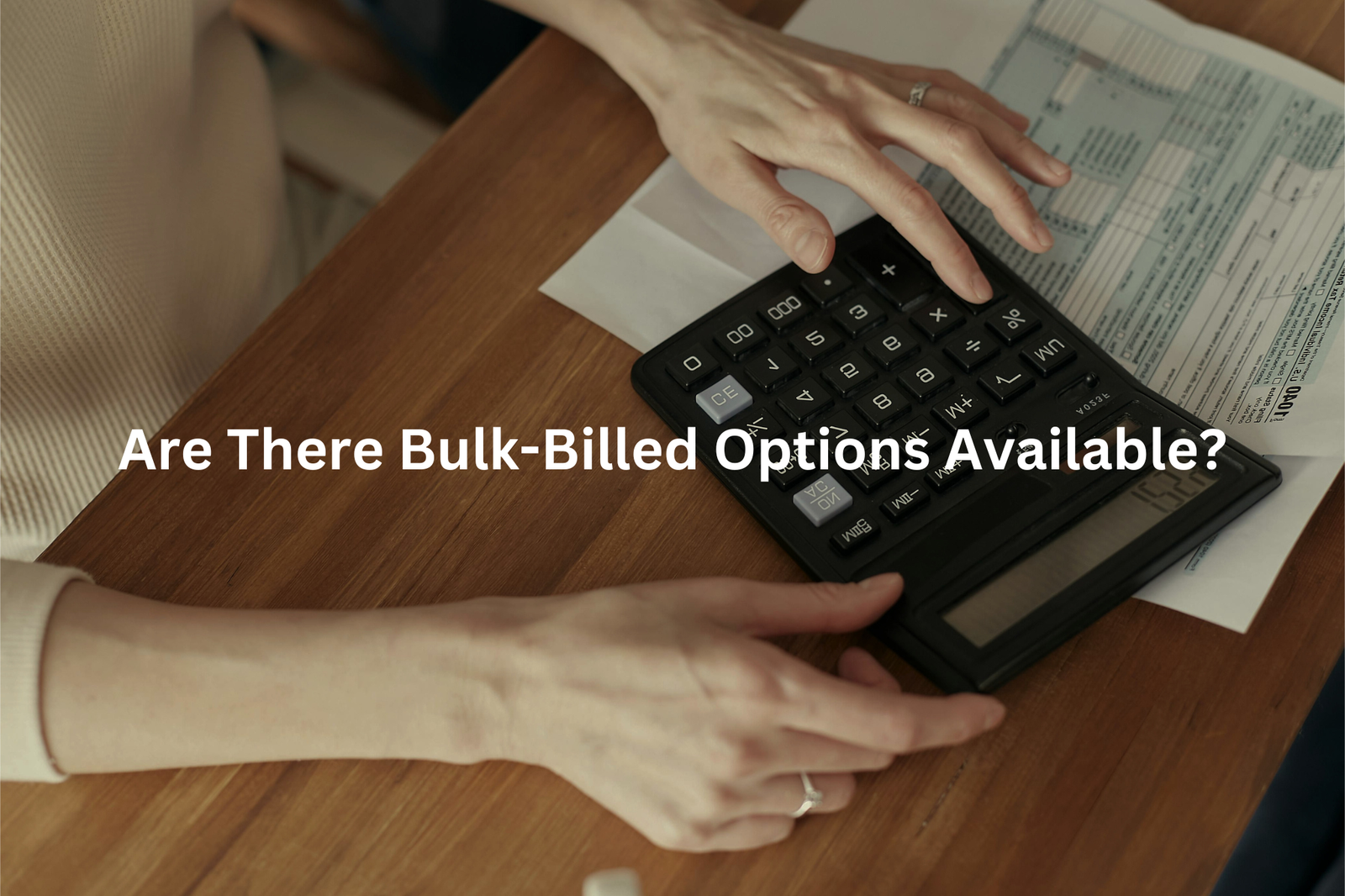 Hands using a calculator while reviewing financial documents with the question Are There Bulk-Billed Options Available overlaid on the image