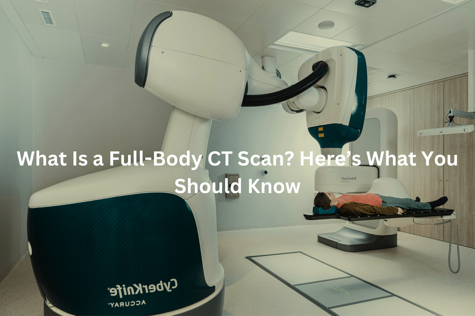 A full-body CT scan machine with a patient lying on the examination table, accompanied by the text "What Is a Full-Body CT Scan? Here's What You Should Know"