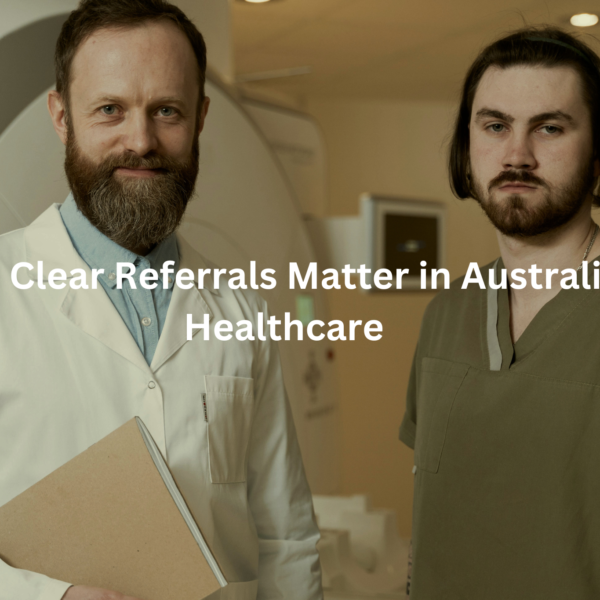 Two healthcare professionals, one with a beard and the other with long hair, standing in a hospital setting with the text "Why Clear Referrals Matter in Australian Healthcare"