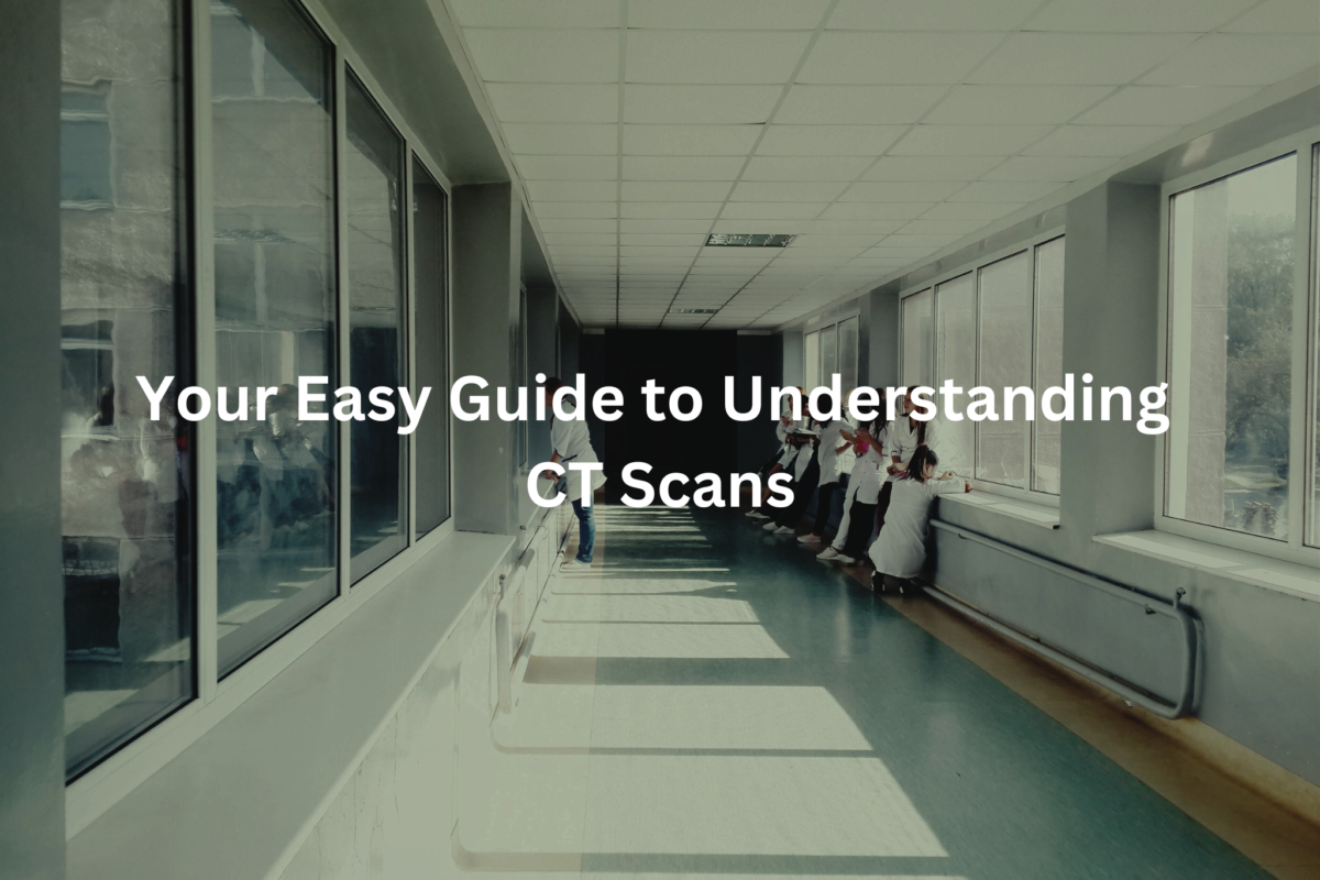 Long hospital hallway with people walking inside, showcasing the title "Your Easy Guide to Understanding CT Scans