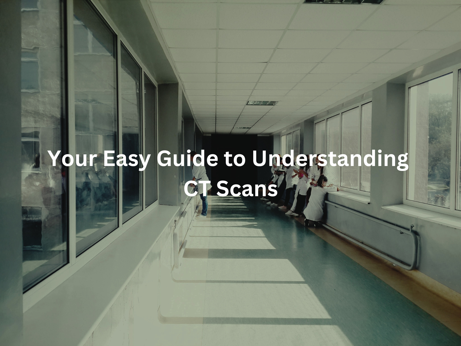 Long hospital hallway with people walking inside, showcasing the title "Your Easy Guide to Understanding CT Scans