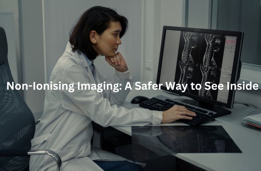 A medical expert reviews diagnostic imagery while seated at a workstation in a hospital or clinic.