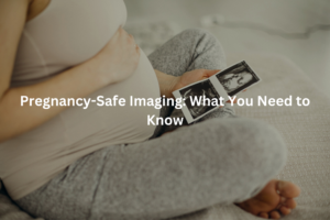 A pregnant person resting on a bed and examining ultrasound images, with the text "Pregnancy-Safe Imaging: What You Need to Know" overlaid.